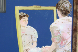 A painting of woman in a pastel dress siting on the floor, looking into a mirror. The painting is done on a mirror and shows the woman from behind and part of her reflection in a mirror she is looking into. 