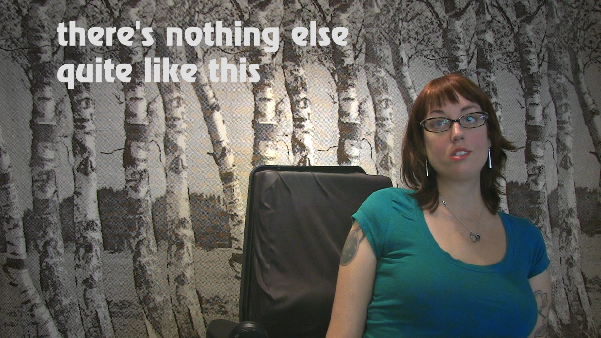 A woman sits in a wheelchair. Behind her is a tapestry of birch trees. Text appears in white on the viewer's left saying "there's nothing else quite like this".