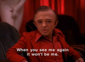 The Man From Another Place wears a red suit, sits in front of an undressed female mannequin and looks seriously at Dale. Caption reads, "When you see me again it won't be me."