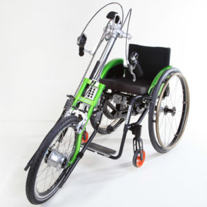 A green attachment that attaches to a wheelchair to convert it into a three-wheeled cycle.